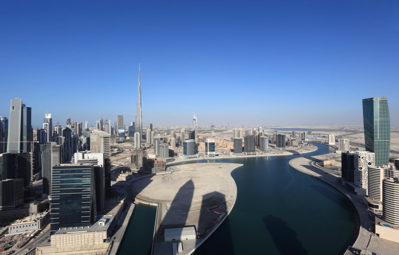 Business Bay waterfront and towers with Burj Khalifa in the skyline